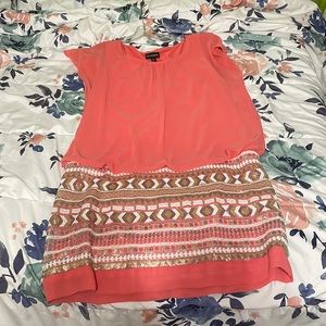 A dress for the spring time. It’s a peach pink on top with a beaded bottom.